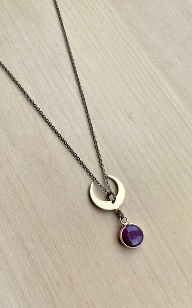 Ruby and brass moon necklace