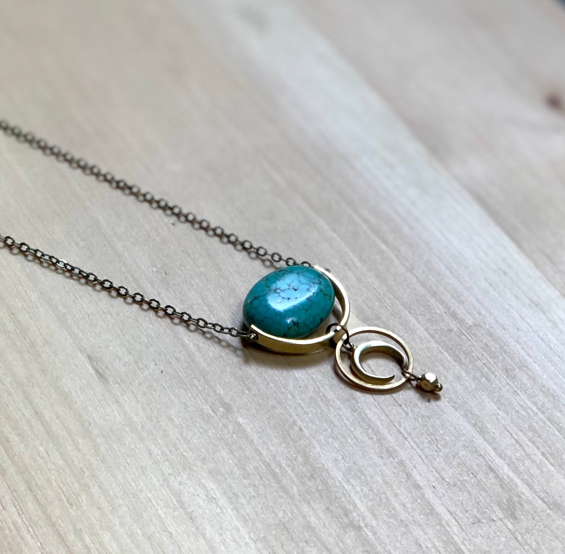 Turquoise and brass moon necklace