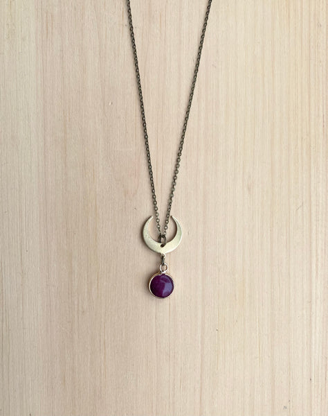 Ruby and brass moon necklace